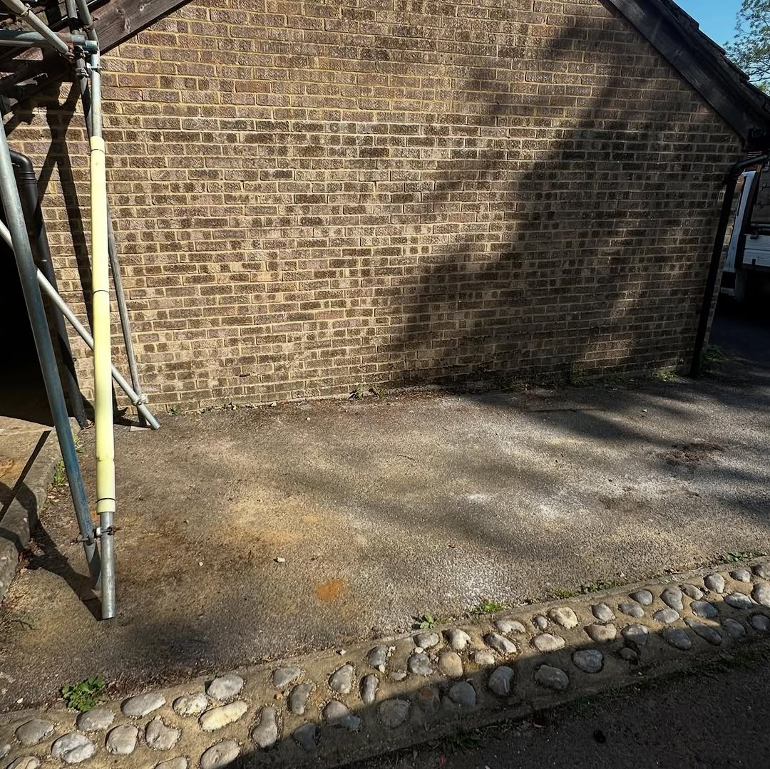 Same brick wall area fully cleared after waste removal