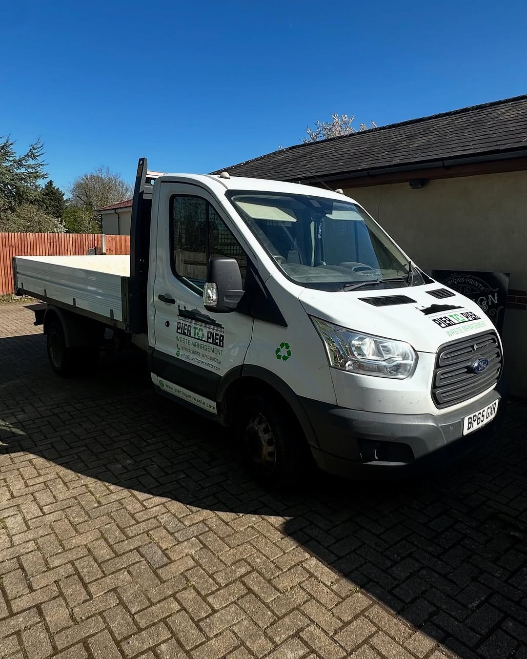 Pier to Pier Waste Management truck ready for a clearance job